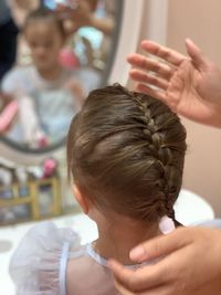 Close-up of girl with handmade hairstyle