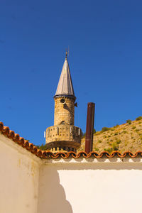 Low angle view of building against clear blue sky