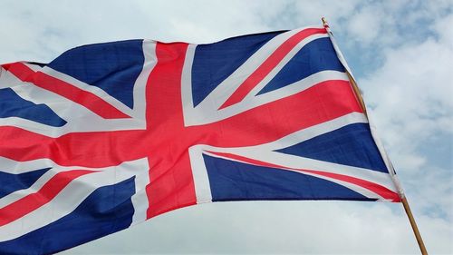 Low angle view of flag against sky