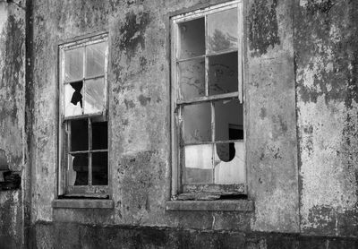 Close-up of window of abandoned building