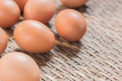 High angle view of eggs in basket on table