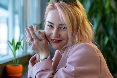 Close-up of young woman drinking glass