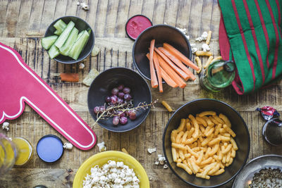 High angle view of snacks and drink on table at home