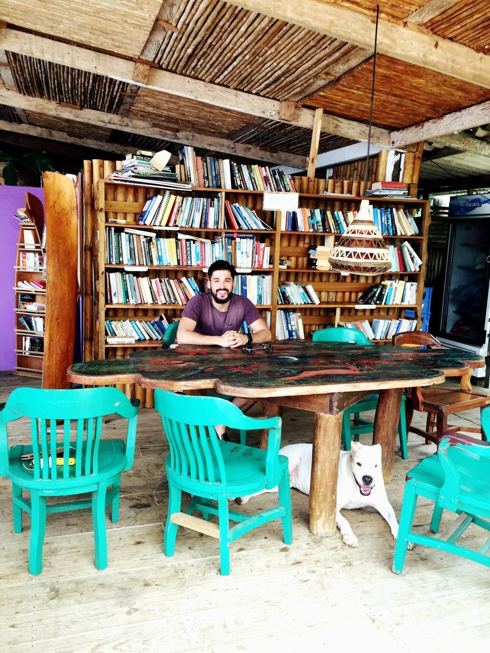 chair, absence, empty, large group of objects, arrangement, indoors, table, wood - material, blue, multi colored, abundance, group of objects, no people, in a row, education, day, variation, furniture, book, seat