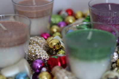 Close-up of multi colored glass on table