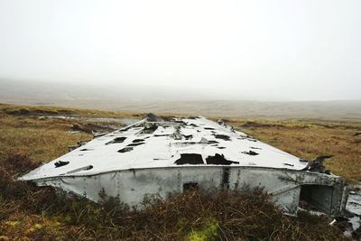 Built structure on field against clear sky