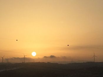 Scenic view of silhouette landscape against sky during sunset