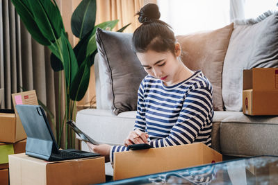 Side view of boy reading book