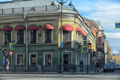 City street and buildings against sky