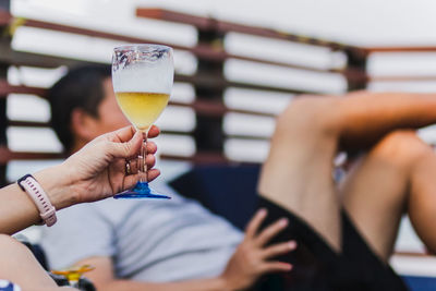 Midsection of woman holding drink