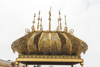 Low angle view of temple against building