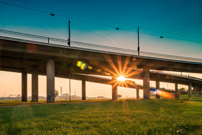 Bridge against clear sky during sunset