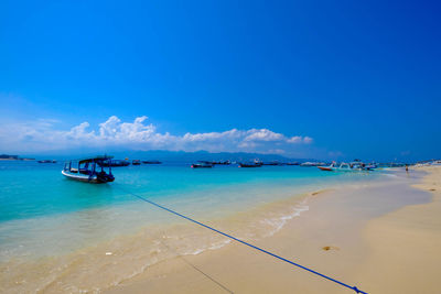 Scenic view of sea against blue sky