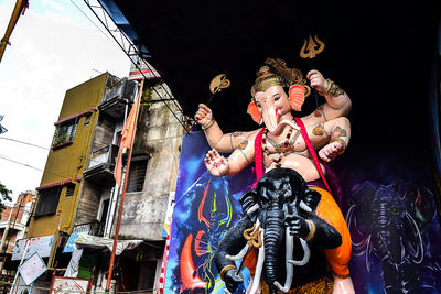 Low angle view of statues against building