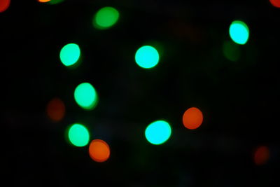 Defocused image of illuminated street lights at night