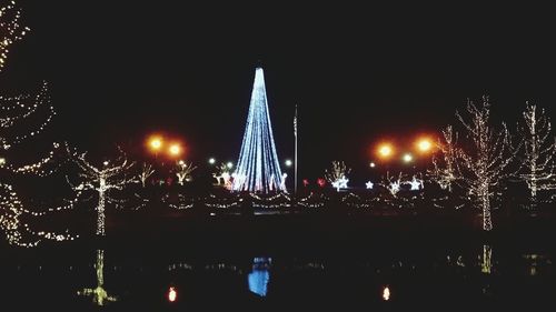 Low angle view of illuminated city at night