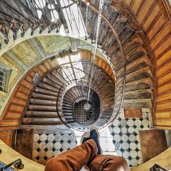 Low section of man on spiral staircase