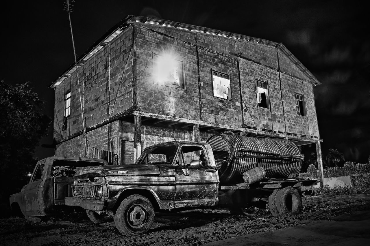 abandoned, night, built structure, old, obsolete, architecture, building exterior, damaged, run-down, deterioration, illuminated, low angle view, no people, old-fashioned, transportation, outdoors, weathered, bad condition, history, the past