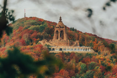 Historic building against sky during autumn