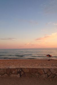 Scenic view of sea at sunset