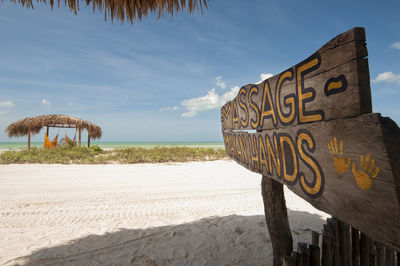 Rustic wooden sign with the text. massage mayan hand. holbox island, mexico.