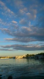 Scenic view of lake against cloudy sky