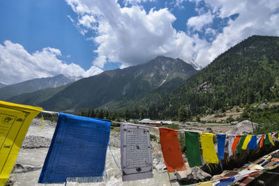 Clothes drying on clothesline against mountains