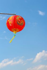 Low angle view of balloons against sky