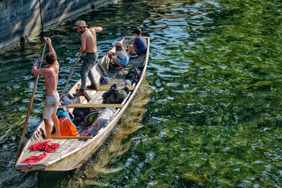 High angle view of people on boat in river