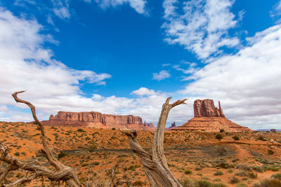 View of rock formations against cloudy sky