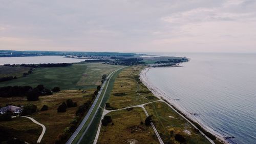 High angle view of road by sea against sky