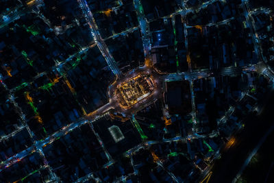 High angle view of illuminated buildings in city at night