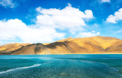 Scenic view of sea against cloudy sky