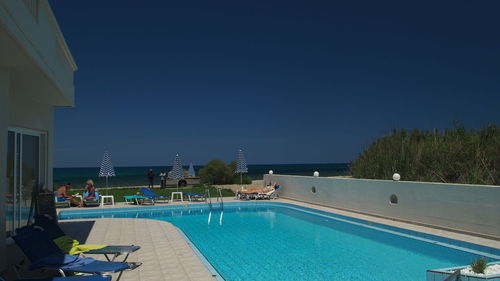 View of water against clear blue sky