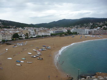 High angle view of beach and buildings against sky