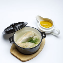 High angle view of food on table against white background