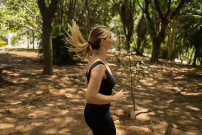 Woman running and jogging at a park outdoors. athlete female person during workout. healthy 