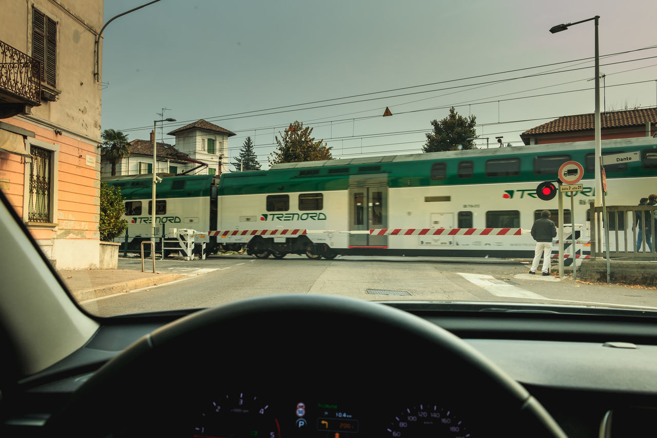 CARS ON ROAD SEEN THROUGH CAR WINDSHIELD