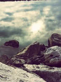 Scenic view of sea against cloudy sky