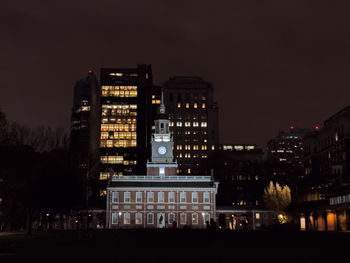 Illuminated buildings in city at night