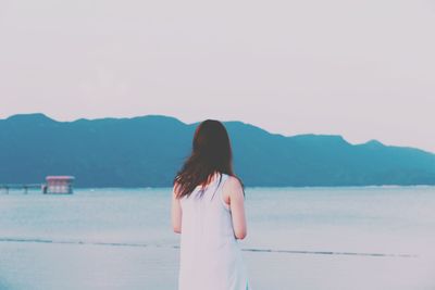 Scenic view of sea with mountains in background