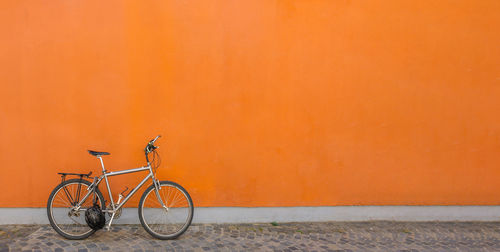 Bicycle against yellow wall