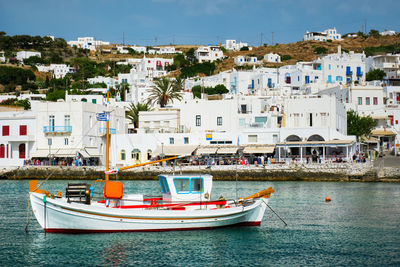 Boats moored at harbor