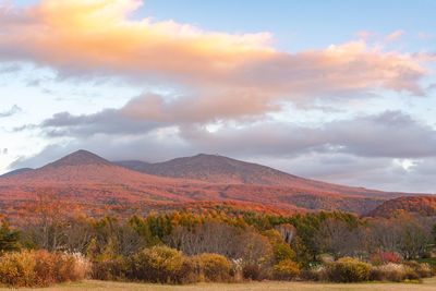 Scenic view of landscape and mountains against sky