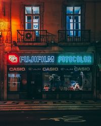 Information sign on illuminated city at night