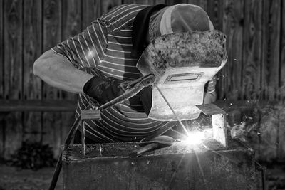 Close-up of worker welding metal in workshop