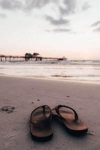 Close-up of sunglasses on beach