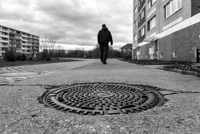 Rear view of man walking on street