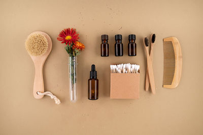 High angle view of beauty products on yellow background