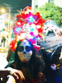 Portrait of woman with multi colored candies in background